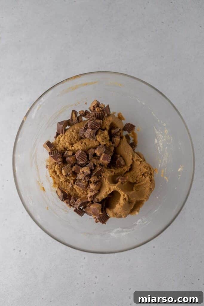 Crumbl's Ultimate Reese's Peanut Butter Cookie 5 Peanut butter cookie dough in a bowl