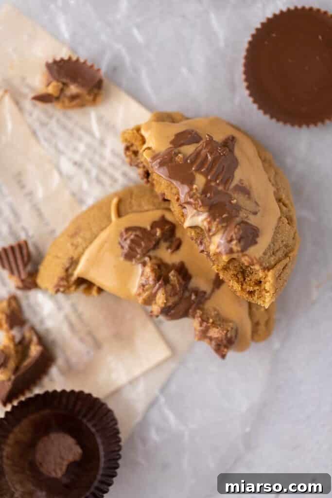 Crumbl's Ultimate Reese's Peanut Butter Cookie 8 Crumbl Reese's peanut butter cup cookies broken in half