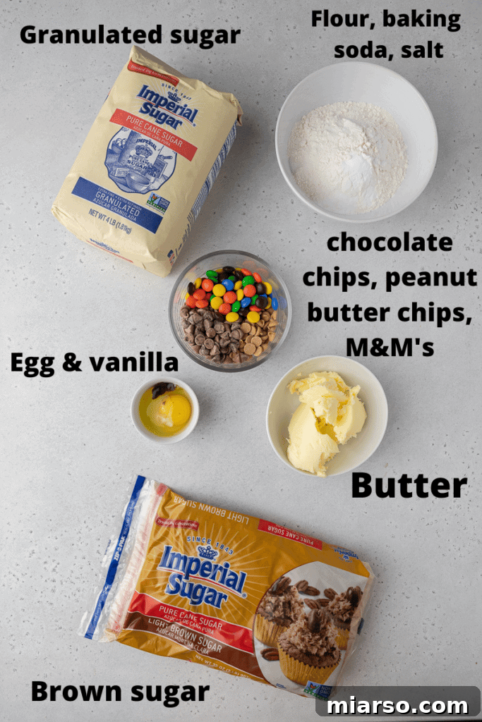 Ingredients for Crumbl monster cookies laid out on a surface.