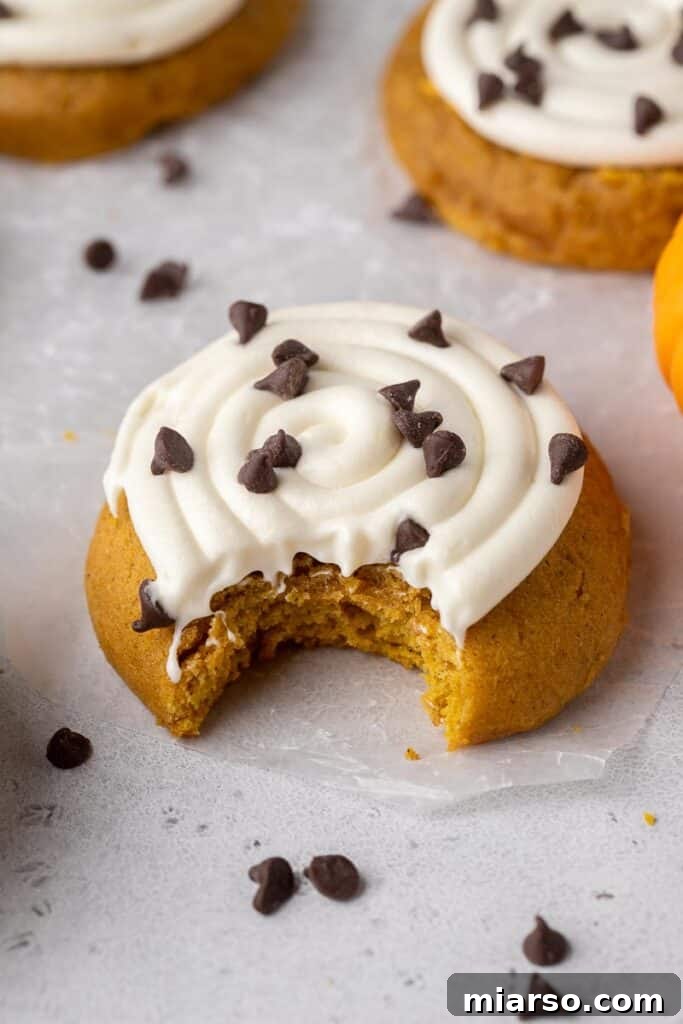Thick crumbl cookie pumpkin cookies with cream cheese frosting