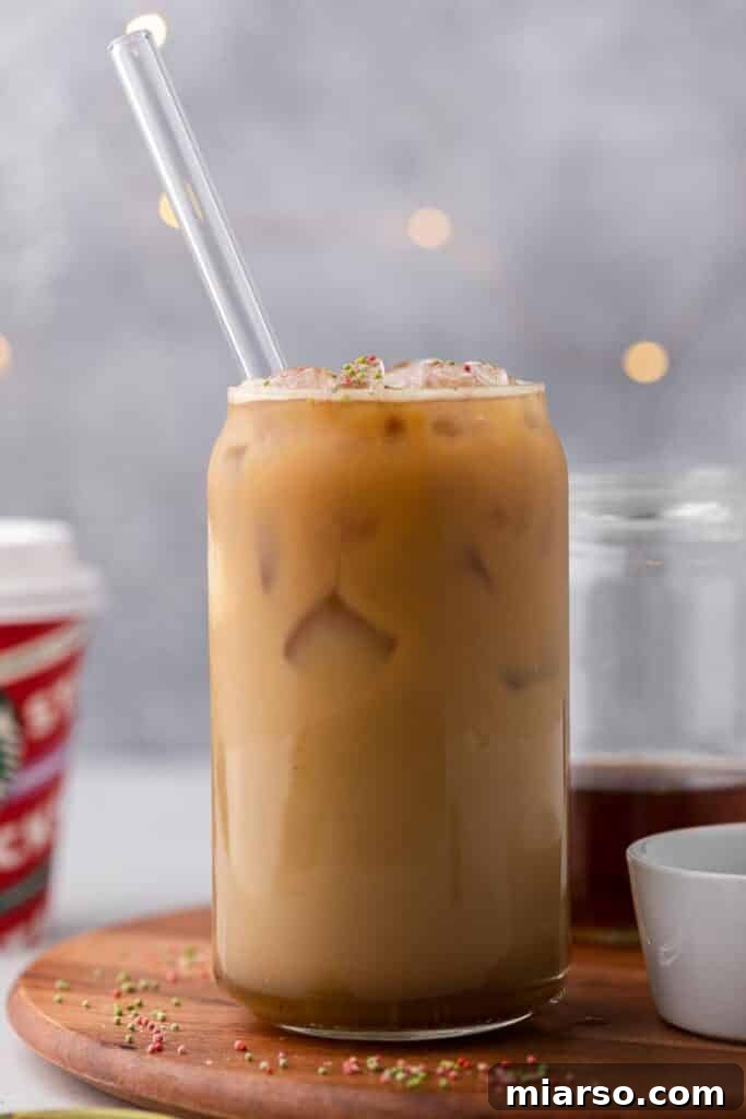 Sweet Almond Sugar Cookie Bliss Starbucks Style 7 A festive Starbucks Sugar Cookie Latte served in a unique glass, showcasing its seasonal charm.