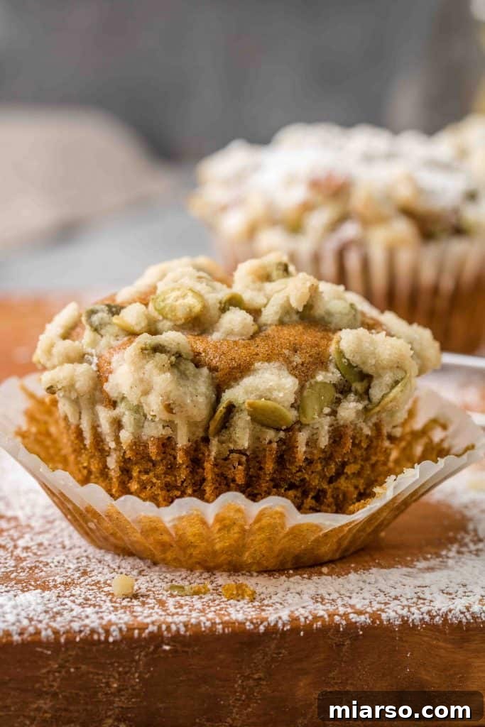 Recipe for pumpkin muffins, bakery-style with streusel.
