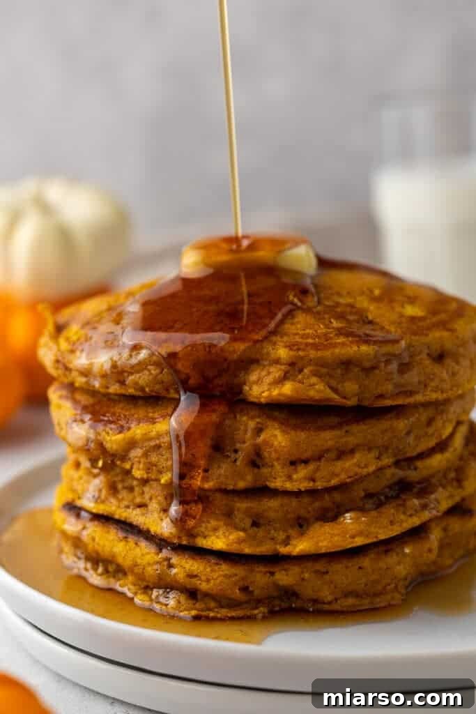 Stack of pumpkin pancakes, a fluffy and festive breakfast.