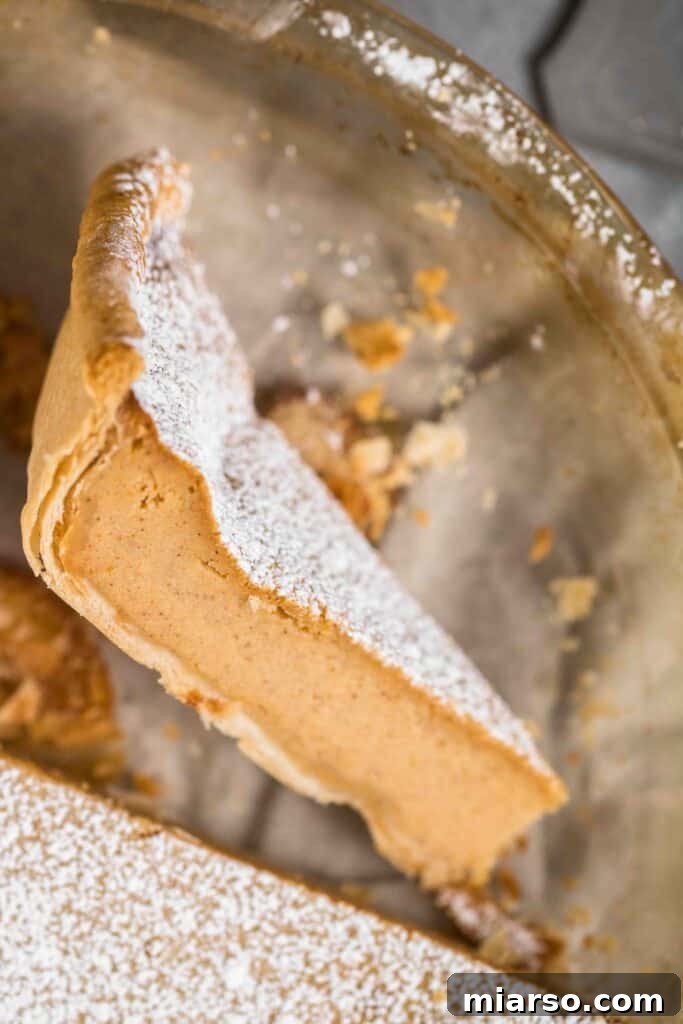 Sweet potato pie slice, a creamy Southern staple for Thanksgiving.