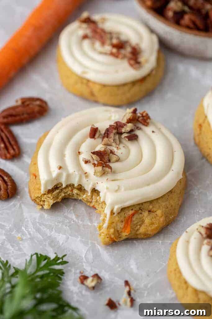 Crumbl carrot cake cookies for Thanksgiving dessert recipes, spiced and frosted perfection.