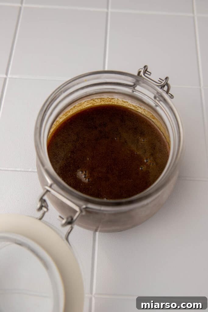 Crumbl Sticky Bun Cookie Perfection 12 Smooth, simmering butterscotch sauce