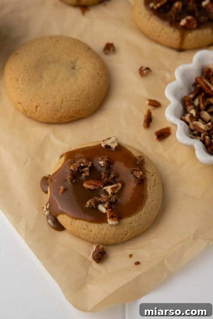 Crumbl Sticky Bun Cookie Perfection 9 Crumbl sticky bun cookies cooling on a rack