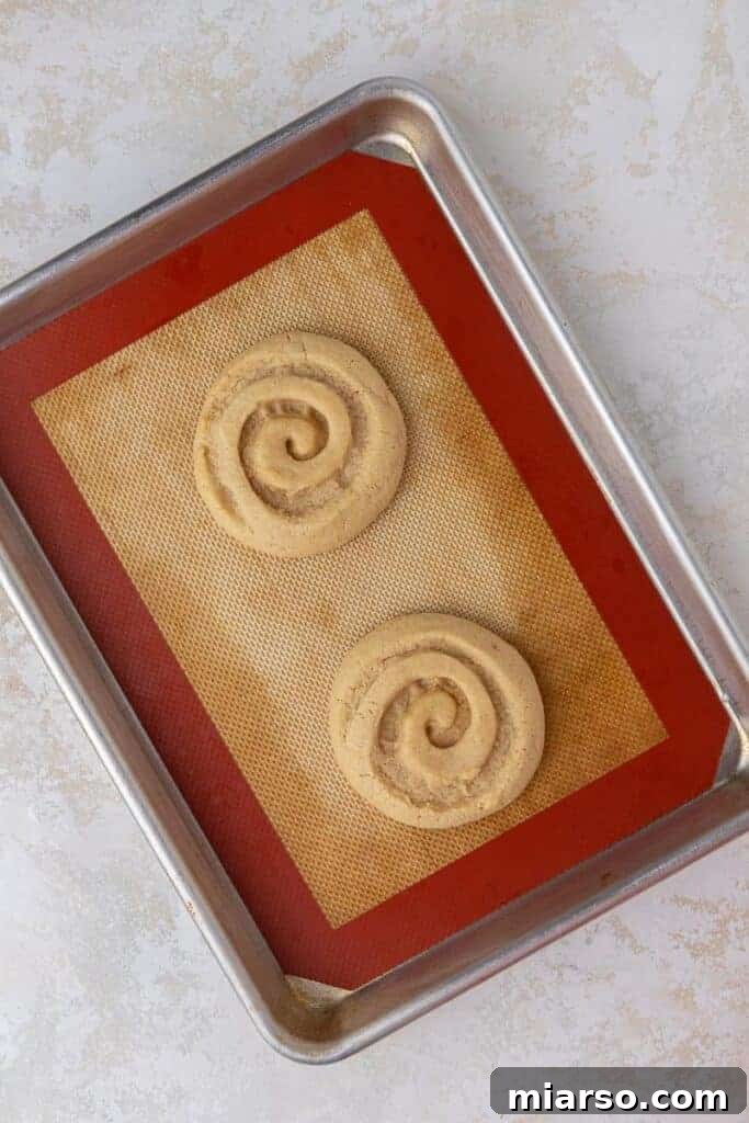 Baked honey bun cookies on baking sheet
