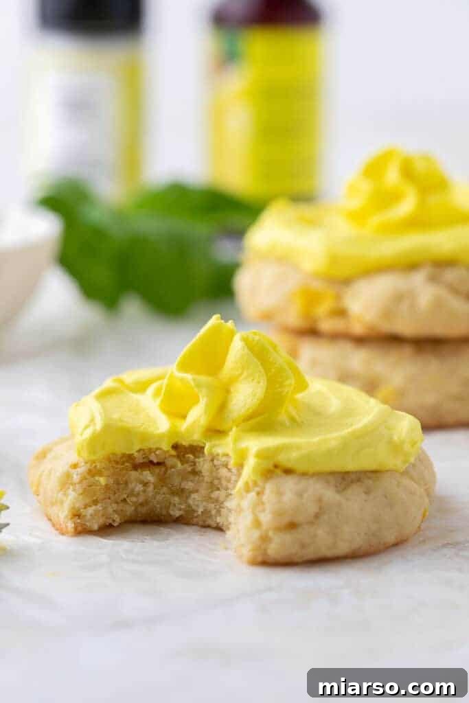 Crumbl's Pineapple Dole Whip Paradise Cookies 13 Crumbl Dole whip cookie with a bite taken out of it