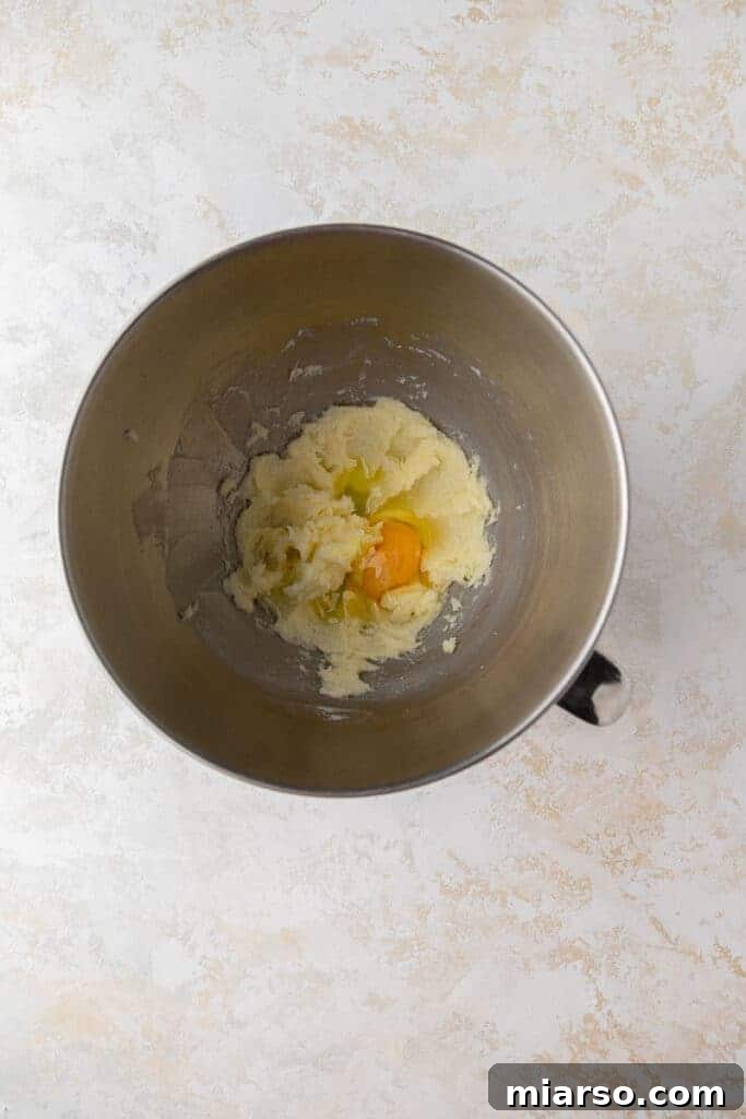 Crumbl's Pineapple Dole Whip Paradise Cookies 5 Creamed butter and egg in mixing bowl