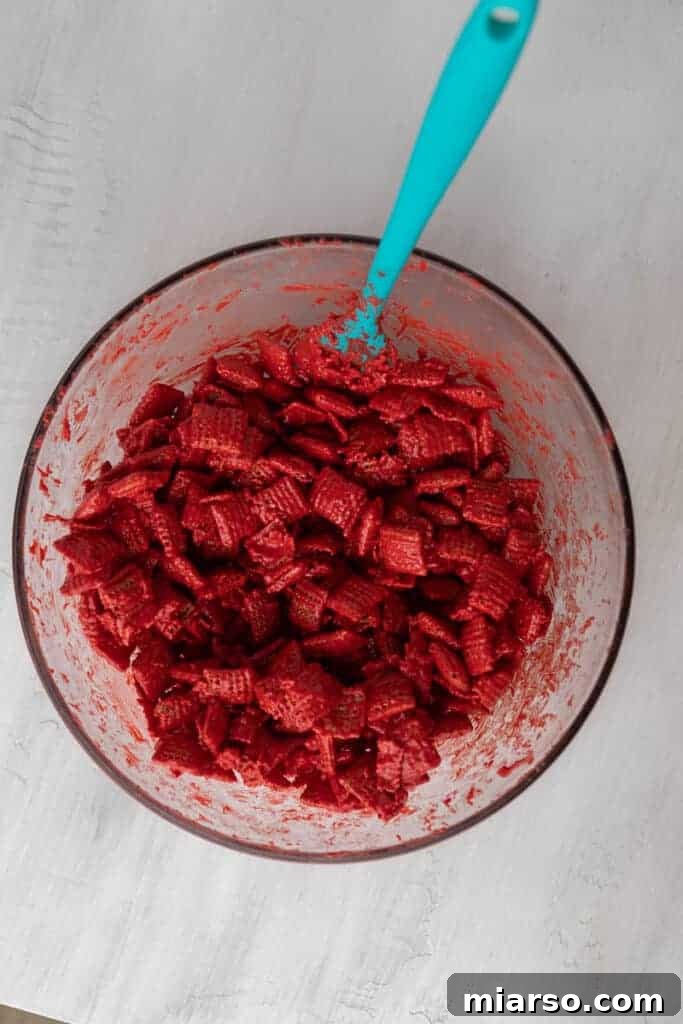 Cupid's Crunch 11 Red candy melt coated Chex cereal, showing the even vibrant color.