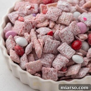 Cupid's Crunch 18 A round close-up image of Valentine's Day muddy buddies in a pile.