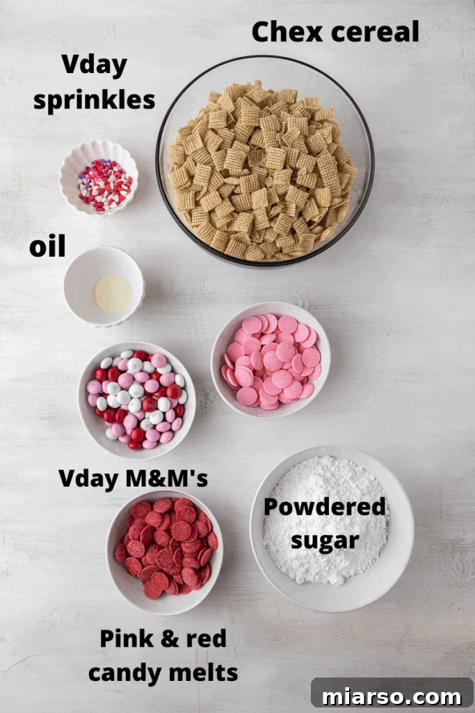 Cupid's Crunch 3 A flat lay of ingredients for Valentine's Day Muddy Buddies: Chex cereal, pink and red candy melts, powdered sugar, Valentine's M&M's, and heart sprinkles.