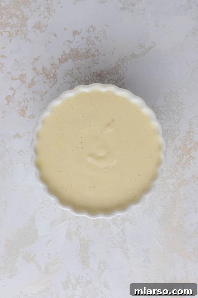 Mixing wet ingredients for custard toast in a bowl