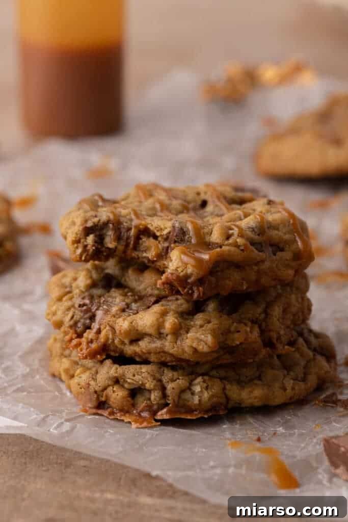 A stack of Crumbl Oatmeal Rolo Cookies on a plate