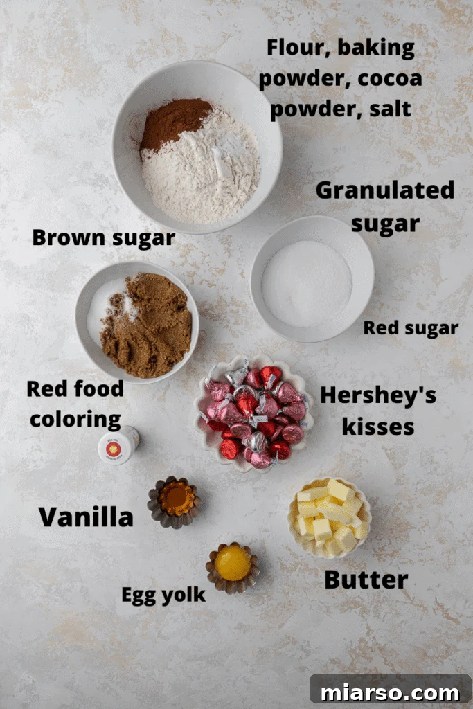 Hershey's Kissed Red Velvet Cookies 4 Ingredients for red velvet blossom cookies laid out on a baking surface