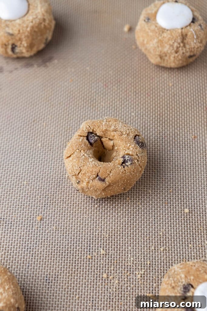 Cookie dough with marshmallow filling before baking