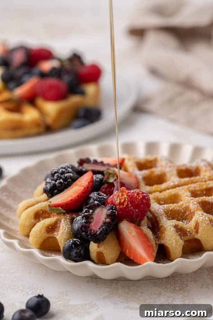 Simply Perfect Buttermilk Waffles 4 Maple syrup drizzled on top of buttermilk waffles