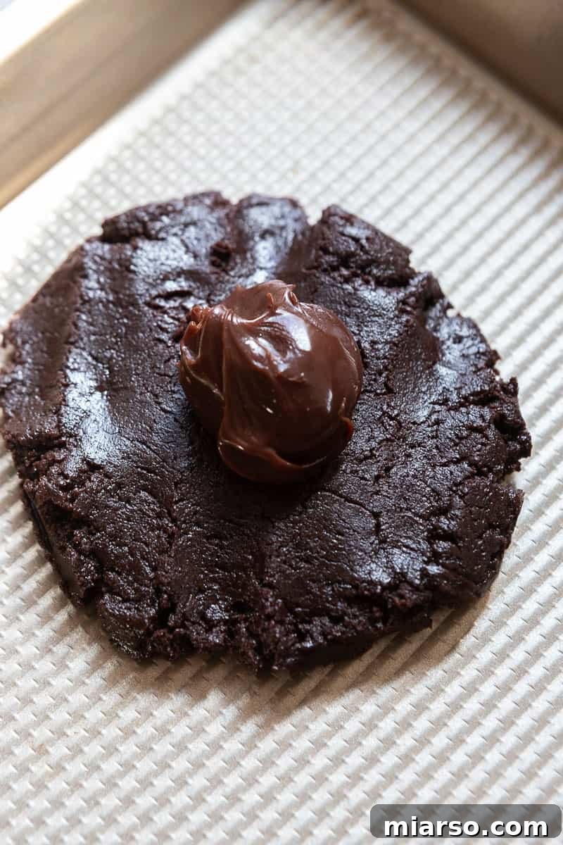 More chocolate cookie dough on a surface