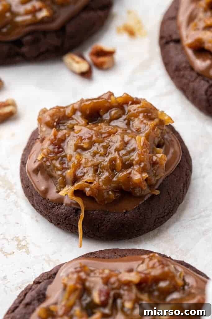 Crumbl German Chocolate Cake Cookies with rich chocolate base and pecan coconut frosting