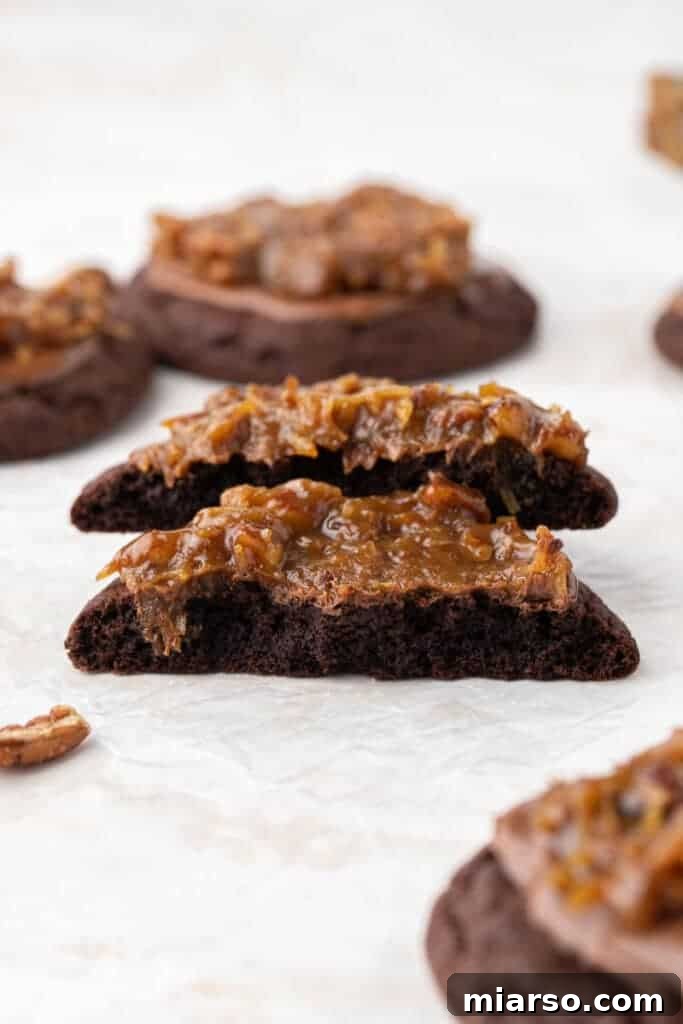 Crumbl German chocolate cookie broken in half showing filling