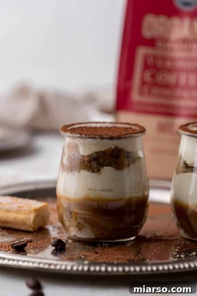 Caramel layered tiramisu in a clear glass