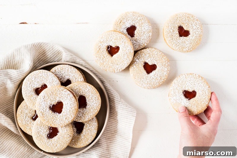 Elegant Linzer cookies with raspberry jam hearts for Valentine's Day