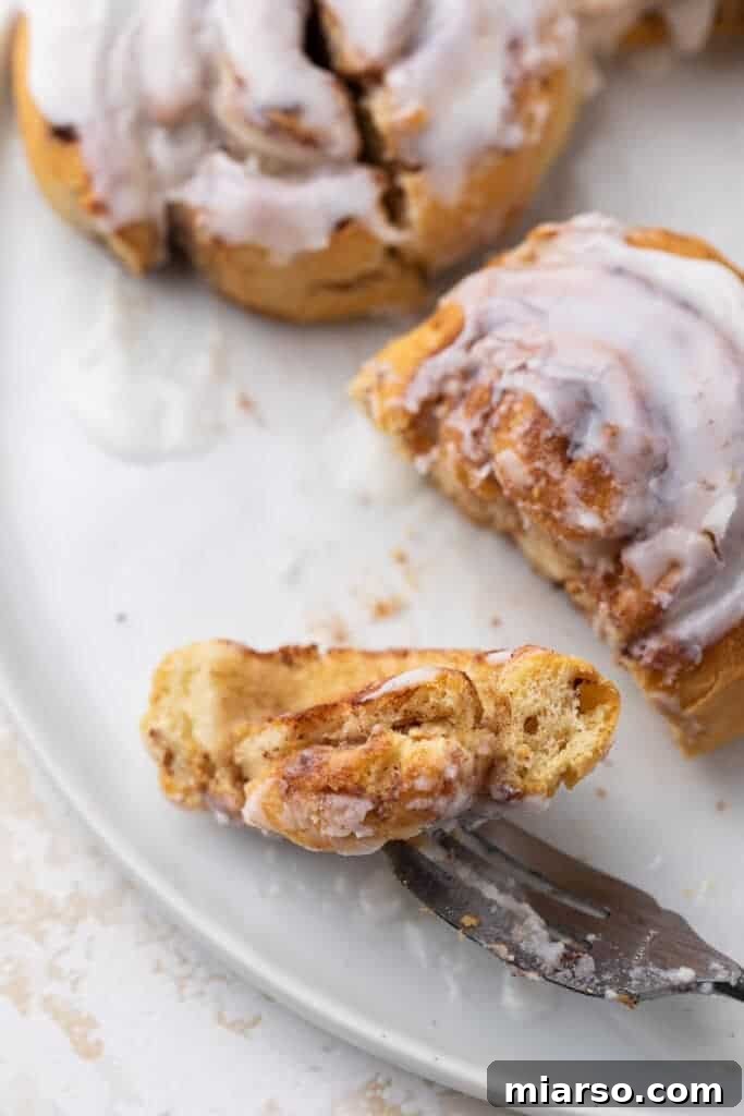Freshly air-fried Pillsbury cinnamon rolls topped with sweet white icing.