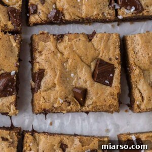 Close-up of blondies showing a desirable crackly shiny crust