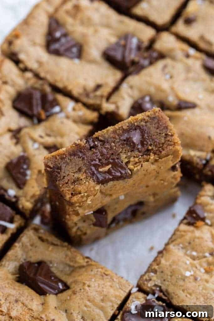 Close-up shot of the fudgy interior of a blondie bar