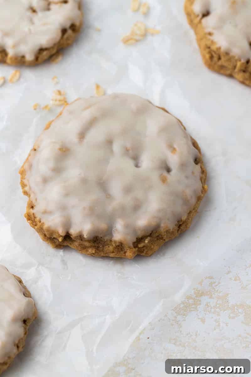 Freshly baked Crumbl iced oatmeal cookies, golden brown and perfectly soft.