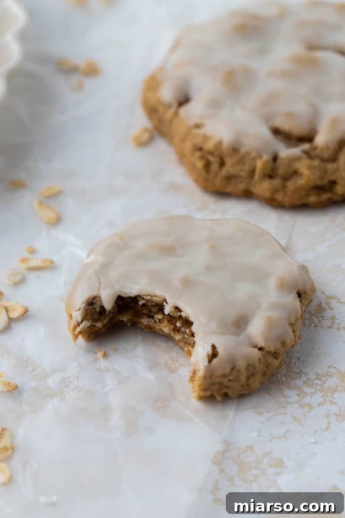 A box of Crumbl catering-style iced oatmeal cookies, showcasing multiple delicious treats.