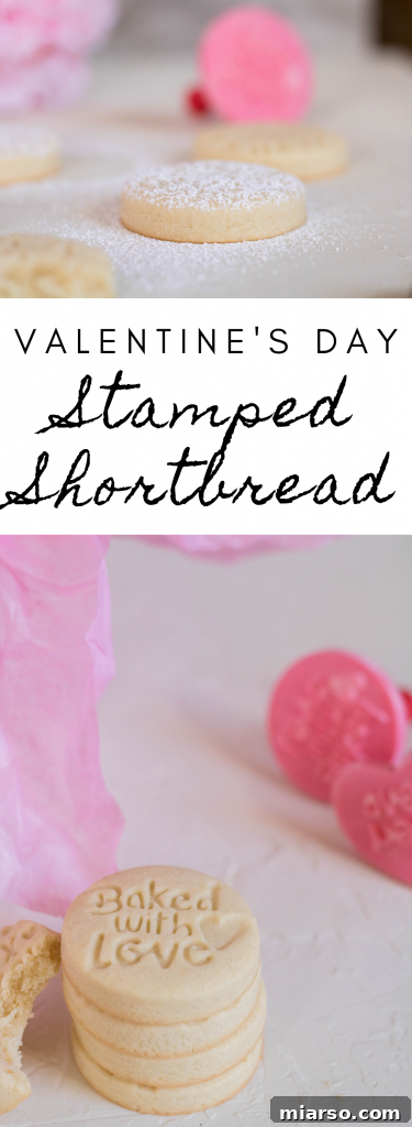 stamped shortbread cookies for valentine's day on a wooden board