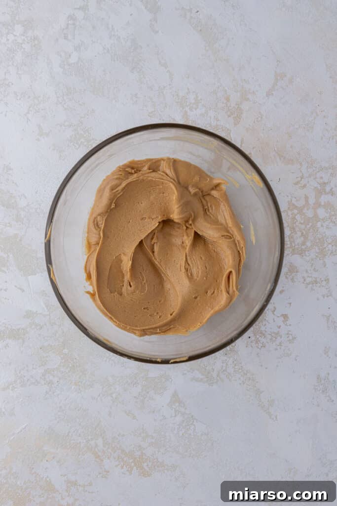 The Ultimate Peanut Butter Brownie Cookies 11 Smooth and creamy peanut butter filling in a bowl, ready to be scooped into cookie dough