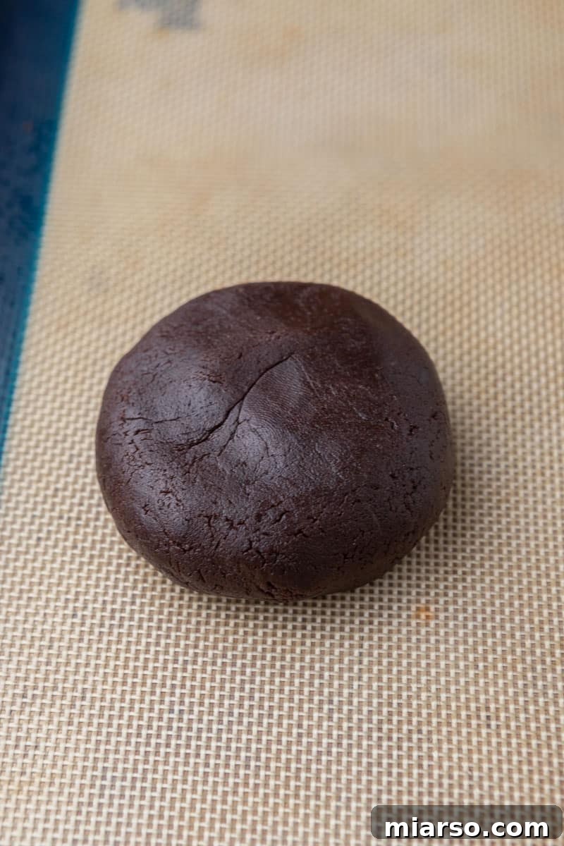 The Ultimate Peanut Butter Brownie Cookies 8 A chocolate cookie dough ball, expertly sealed with a peanut butter filling inside