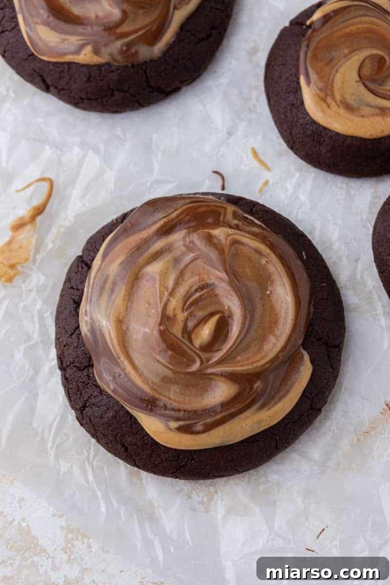 The Ultimate Peanut Butter Brownie Cookies 10 A freshly baked Crumbl-inspired peanut butter brownie cookie, topped with chocolate and peanut butter swirls