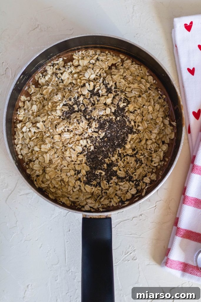 Adding the oats and chia to the liquid mix