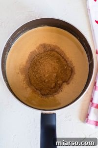 adding coconut sugar to the melted ingredients