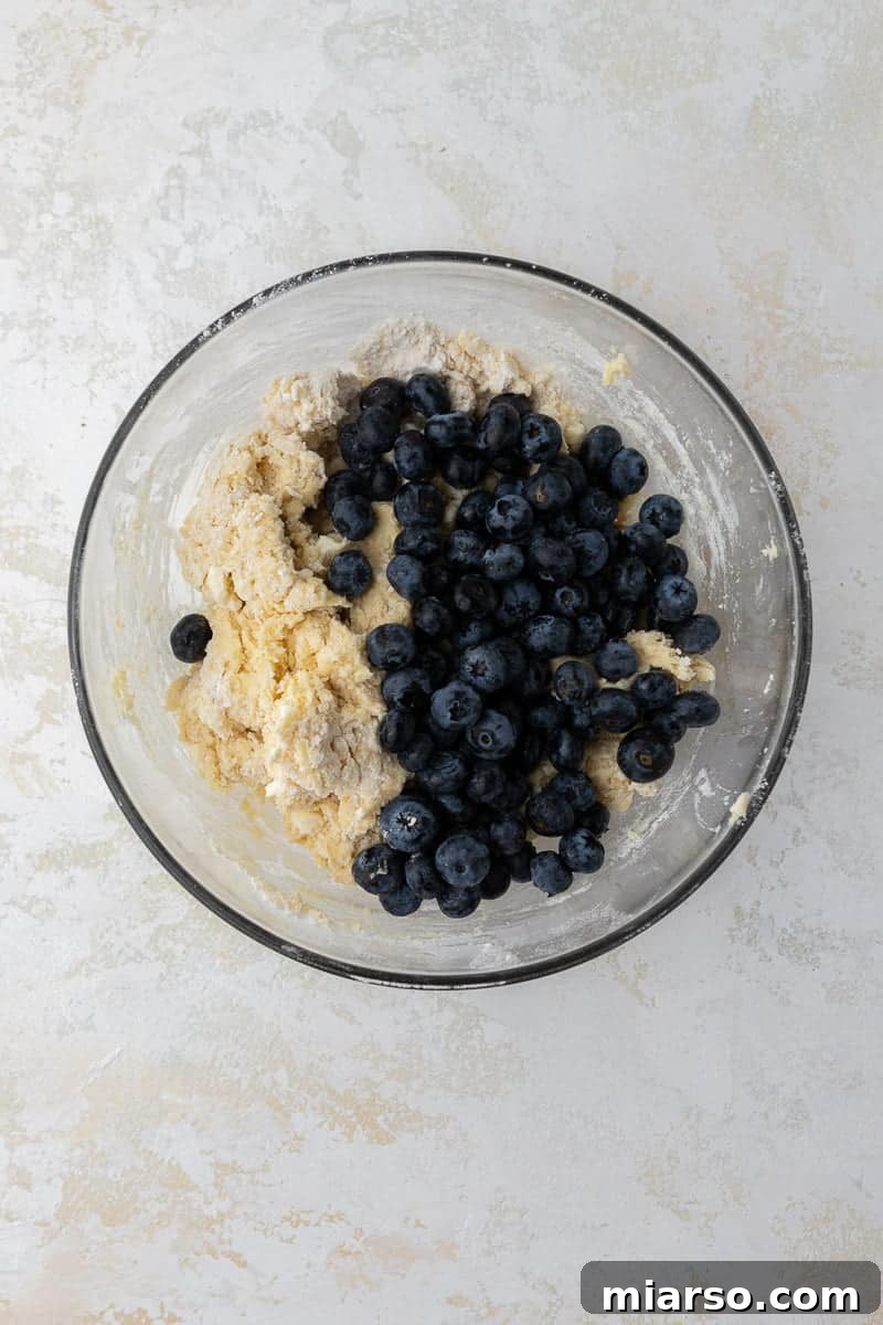 Blueberry scone dough in a bowl after mixing