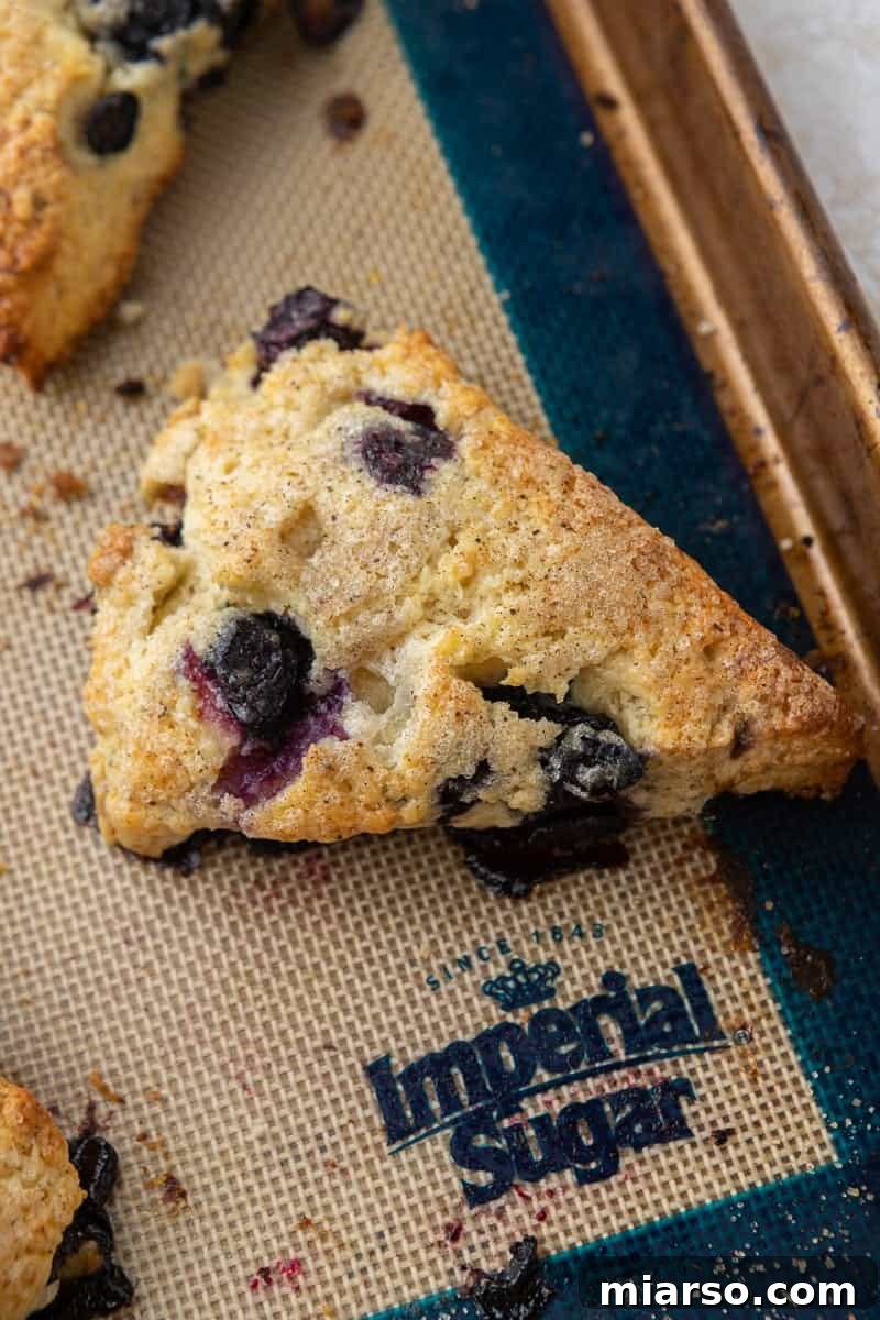 Freshly baked Starbucks blueberry scones on a baking sheet