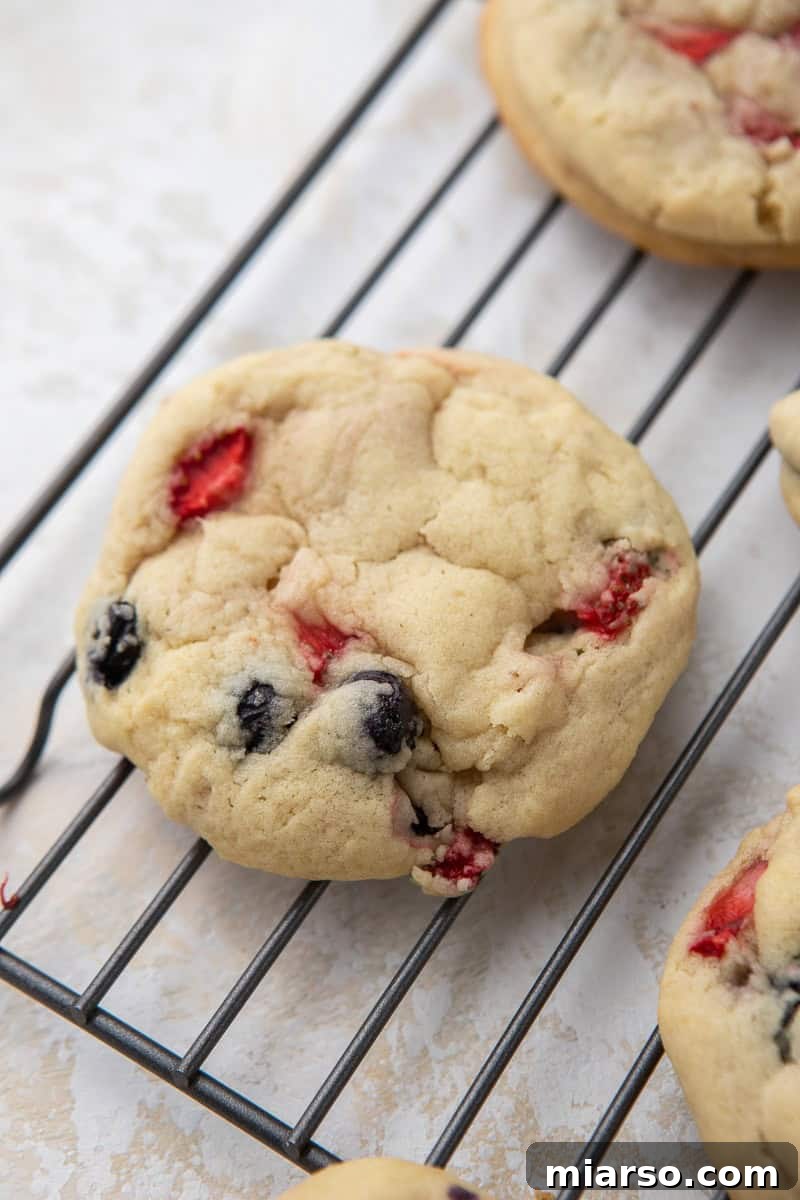Freshly baked berry cookie cooling on a wire rack