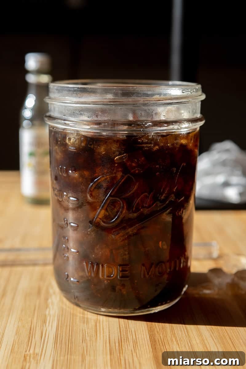 Mastering Starbucks Chocolate Cream Cold Brew at Home 6 A glass filled with cold brew coffee and ice, ready for the chocolate cream foam