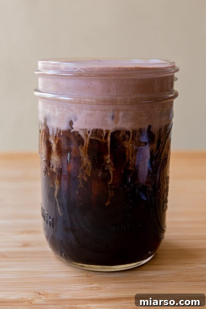 Mastering Starbucks Chocolate Cream Cold Brew at Home 8 Close up of Starbucks chocolate cream cold foam cold brew showing the layered drink