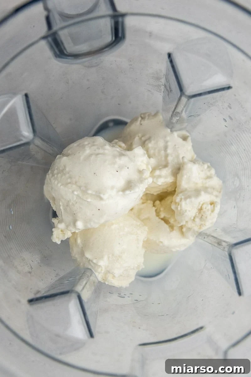Ice cream in a blender ready to be mixed for a milkshake