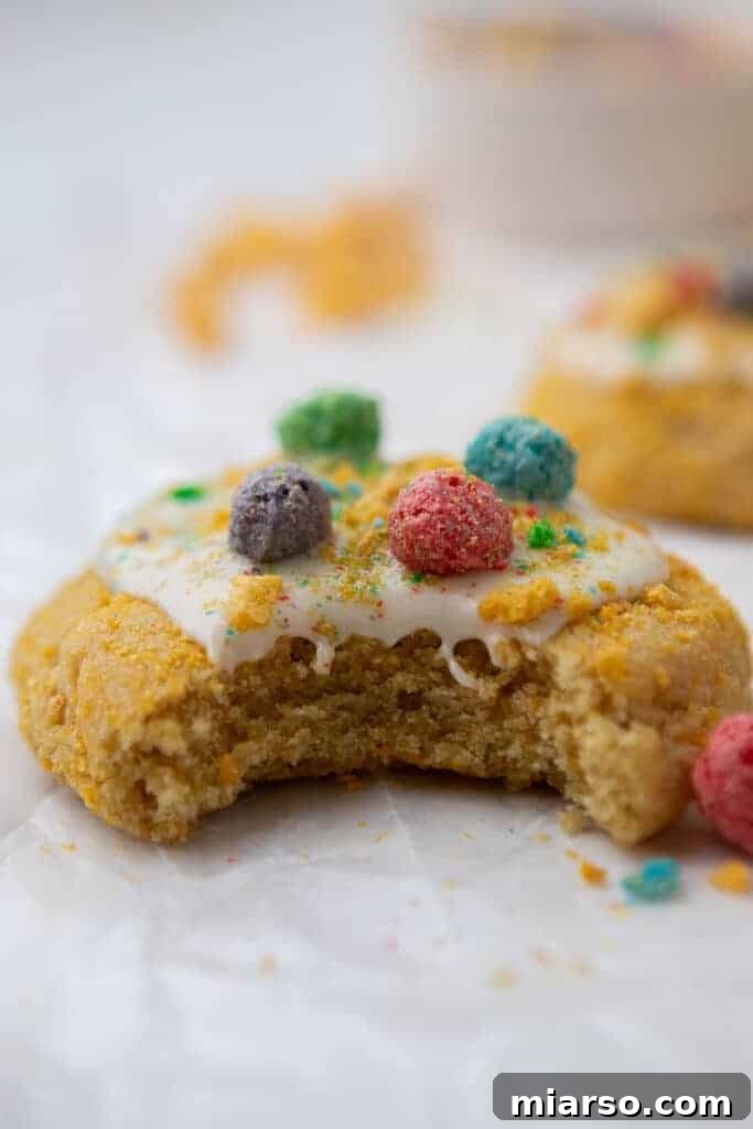 Homemade Crumbl Berry Crunch Cookie Perfection 3 Close-up of a Crumbl-inspired berry crunch cookie with a bite taken out, showing the intricate texture and glaze.