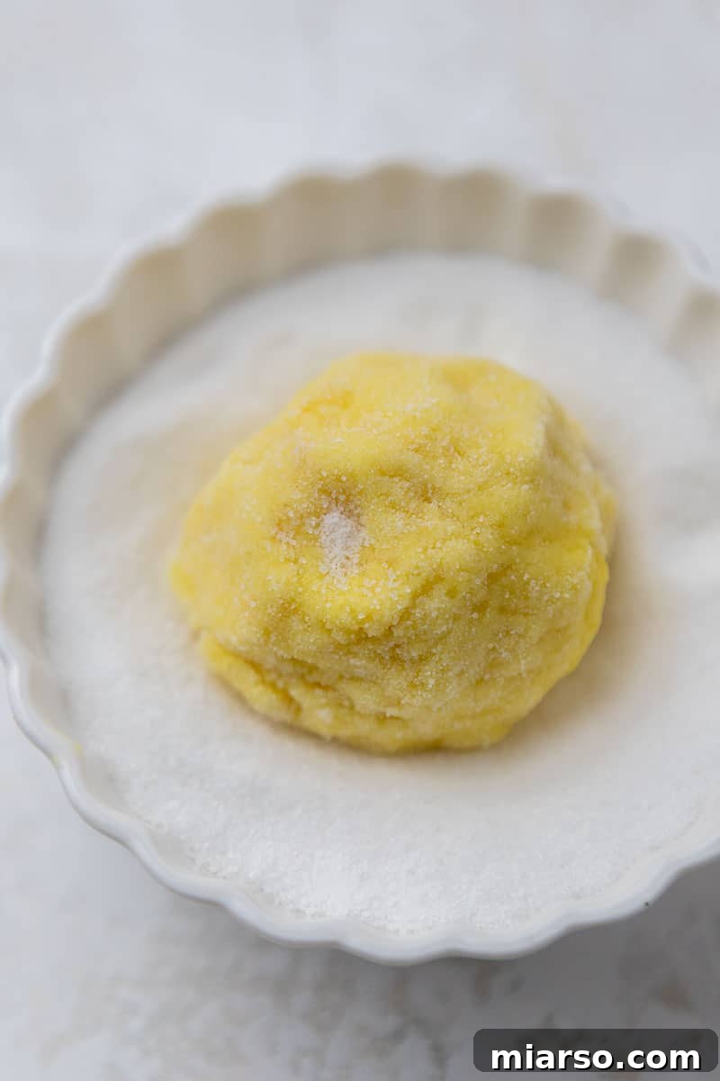 Perfectly Crinkled Lemon Cookies with Cake Mix 8 Lemon cookie dough rolled in granulated sugar