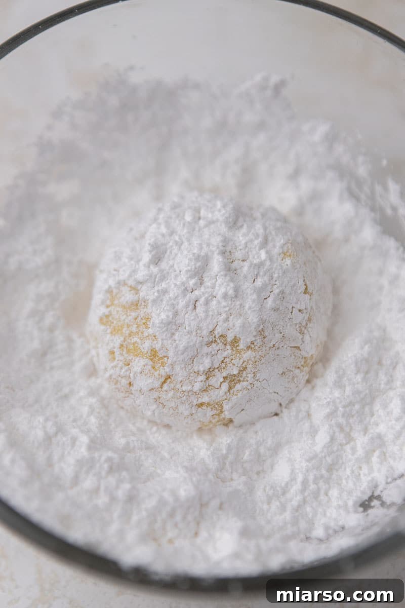 Perfectly Crinkled Lemon Cookies with Cake Mix 9 Lemon cookie dough rolled in powdered sugar