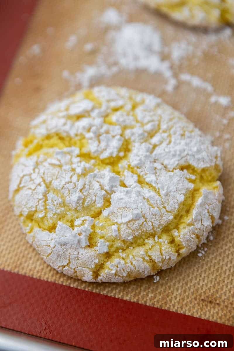 Perfectly Crinkled Lemon Cookies with Cake Mix 10 Lemon crinkle cookie on baking sheet