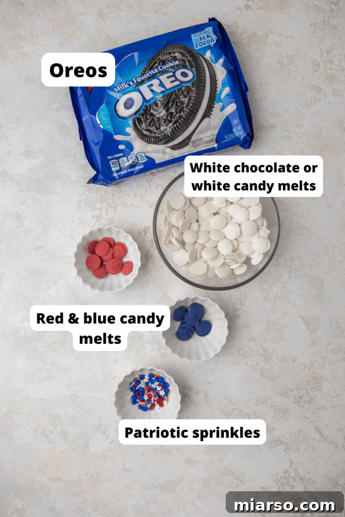 Red, White, & Blue Oreo Delights 3 Essential ingredients laid out for making 4th of July Oreos, including Oreos, white chocolate, red and blue candy melts, and patriotic sprinkles.