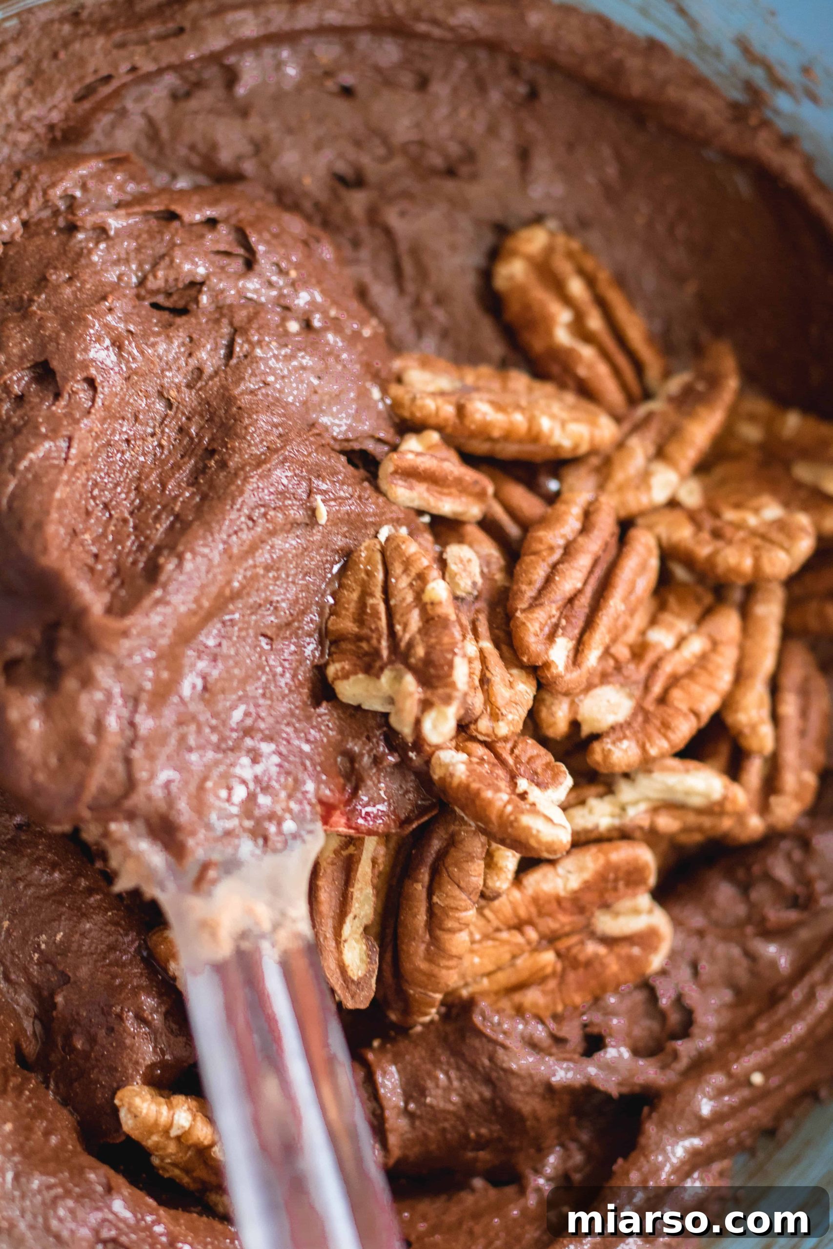 Bake Irresistibly Chewy Brownies with Cocoa Powder 10 adding nuts to the brownies
